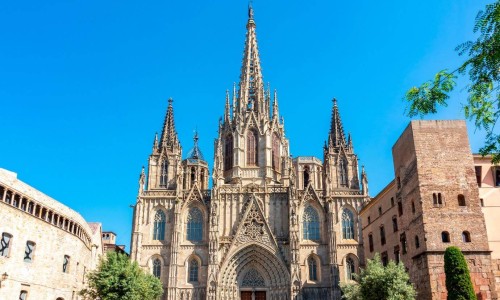 Front view of the Sagrada Família in Barcelona Spain on a sunny bright day.